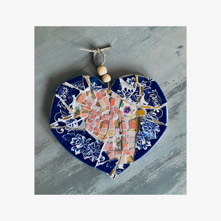 Example of a beautifully crafted mosaic heart using smalti tiles and crockery pieces. Blue and pink mosaic heart.