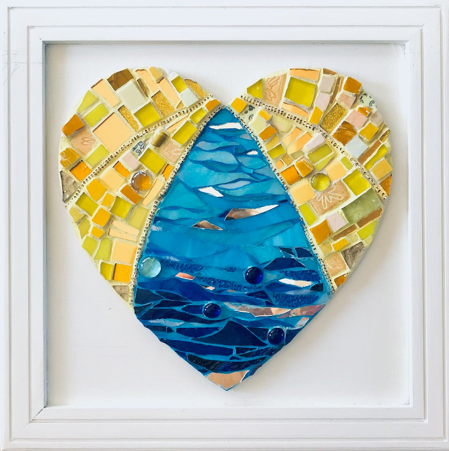 Water theme mosaic work of art. Stained glass , ceramic , grout. Heart shaped work of art.