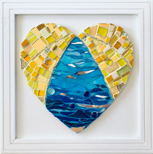 Water theme mosaic work of art. Stained glass , ceramic , grout. Heart shaped work of art.