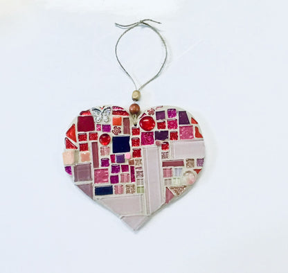 Beautiful pink and red mosaic heart using tiles from MEMOmosaics's DIY mosaic art kits.