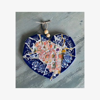 Example of a beautifully crafted mosaic heart using smalti tiles and crockery pieces. Blue and pink mosaic heart.